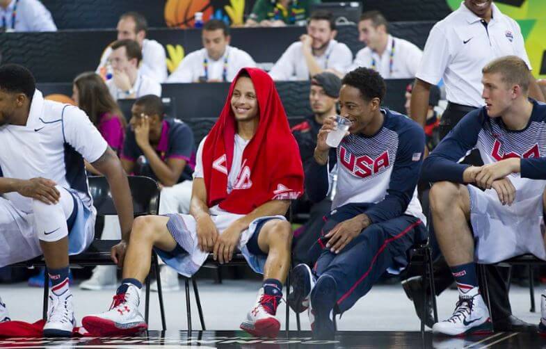 Jogadores de basquete e Stephen Curry